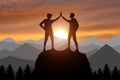 Silhouette of two happy climber conquered the top Royalty Free Stock Photo