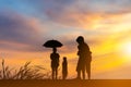 Silhouette of two kids playing with father and mother having fun on evening sunset, Happy family concept Royalty Free Stock Photo