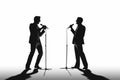 Silhouette of a two male vocalists singing with microphones