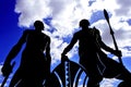 Silhouette of two Masai warriors men standing in the African savannah Royalty Free Stock Photo