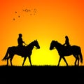 Silhouette of two riders on sunrise Royalty Free Stock Photo