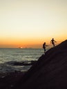 Silhouette of two rock climbers at sunset Royalty Free Stock Photo