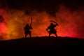 Silhouette of two samurais in duel. Picture with two samurais and sunset sky