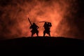 Silhouette of two samurais in duel. Picture with two samurais and sunset sky Royalty Free Stock Photo