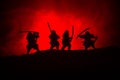 Silhouette of two samurais in duel. Picture with two samurais and sunset sky