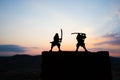 Silhouette of two samurais in duel. Picture with two samurais and sunset sky Royalty Free Stock Photo