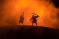 Silhouette of two samurais in duel. Picture with two samurais and sunset sky Royalty Free Stock Photo