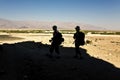 Silhouette of two trackers comeing back from a track at the mosaic canyon in Death valley