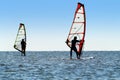 Silhouette of a two windsurfers Royalty Free Stock Photo