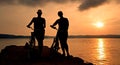 Silhouette of two women with bicycles Royalty Free Stock Photo