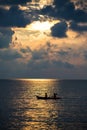 Silhouette two women kayaking boat on sea at sunset Royalty Free Stock Photo