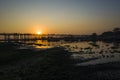 Silhouette of U Bein bridge with reflection in water at sunset in Amarapura, Mandalay, Myanmar Royalty Free Stock Photo