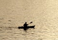 Silhouette of undefined kayaer on water at beautiful sunset time. Santa Cruz Royalty Free Stock Photo