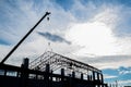 Silhouette under construction site with contractor's worker