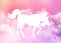 Silhouette of a unicorn on a sugar cotton candy clouds background