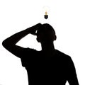 Silhouette of an unknown man thinking how to solve the problem, confusedly the scaly head on a white isolated background, concept Royalty Free Stock Photo