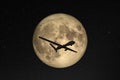 Silhouette of unmanned aerial vehicle UAV flying against background of huge full moon in dark starry space. Elements of this