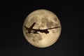 Silhouette of unmanned aerial vehicle UAV flying against background of huge full moon in dark starry space. Elements of this