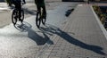 Silhouette of unrecognised people cycling outdoor. People exercising. Healthy lifestyle outdoor