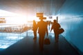 Silhouette of a unrecognizable business travelers people at international airport