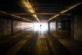 Silhouette of unrecognizable person and daylight ahead in subway tunnel