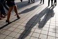 Silhouette of unrecognized people walking in the street.