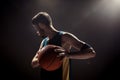 Silhouette view of a basketball player holding basket ball on black background Royalty Free Stock Photo