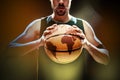 Silhouette view of a basketball player holding basket ball on black background Royalty Free Stock Photo