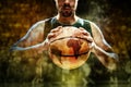 Silhouette view of a basketball player holding basket ball on black background Royalty Free Stock Photo