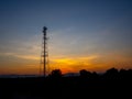 Silhouette view of cellphone antenna under twilight sky Royalty Free Stock Photo