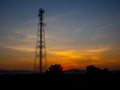 Silhouette view of cellphone antenna under twilight sky Royalty Free Stock Photo