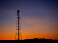 Silhouette view of cellphone antenna under twilight sky Royalty Free Stock Photo