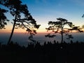 Silhouette view of crowd and colorful sky at peak mountain