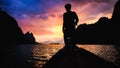 Silhouette view fisherman standing on boat with dramatic sunset light sky clouds mountain background in Thailand Royalty Free Stock Photo