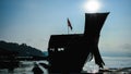 Silhouette view of Thai long tail boat on water with sunlight background in Thailand Royalty Free Stock Photo