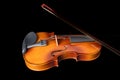 Silhouette of a violin and a bow on it isolated on a black background. Royalty Free Stock Photo