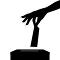 Silhouette of voter woman putting ballot into voting box