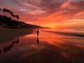 Silhouette of a walking lonely woman on the beach during the sunset or sunrise Royalty Free Stock Photo