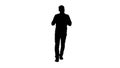Silhouette Walking man pointing and explaining something. Royalty Free Stock Photo