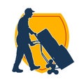 Silhouette of a warehouse worker push a lori chart or hand truck tool transporting boxes. Royalty Free Stock Photo