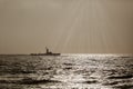 Silhouette of a warship at sunset