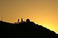 Silhouette of a wind mill in the sunset in greece Royalty Free Stock Photo