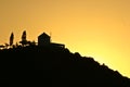 Silhouette of a wind mill in the sunset in greece Royalty Free Stock Photo