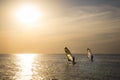 Silhouette of a wind-surfer on waves sunset Royalty Free Stock Photo