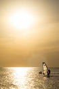 Silhouette of a wind-surfer on waves sunset Royalty Free Stock Photo