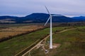 Silhouette of a wind turbine on a mountain at sunset, a windmill in the Ukrainian Carpathians, a windmill close up, top view