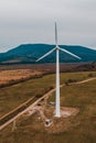 Silhouette of a wind turbine on a mountain at sunset, a windmill in the Ukrainian Carpathians, a windmill close up, top view