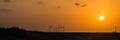 Wind turbines at orange sunset in the rural of Corpus Christi, Texas, USA Royalty Free Stock Photo