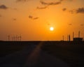 Wind turbines at orange sunset in the rural of Corpus Christi, Texas, USA Royalty Free Stock Photo