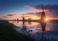 Silhouette of windmills at sunrise in Kinderdijk, Netherlands Royalty Free Stock Photo